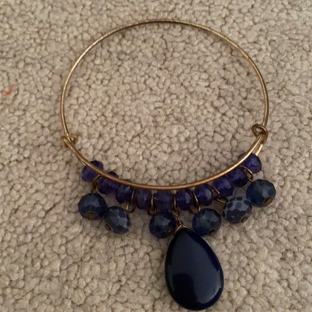 Gold bangle with navy dangling beads